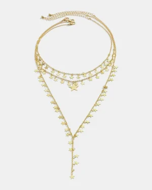 collar en capas de estrellas doradas